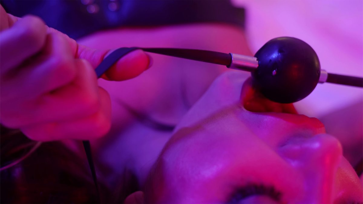 Woman and ball gag