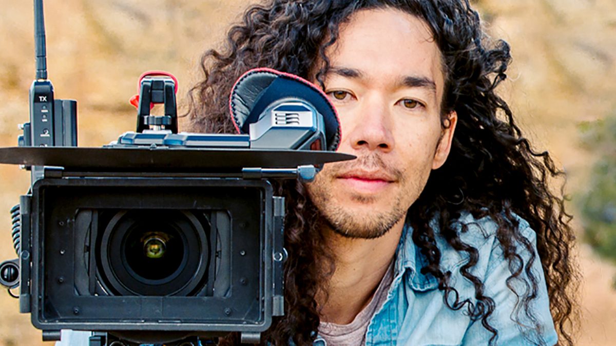 Filmmaker Cole Walliser behind a camera