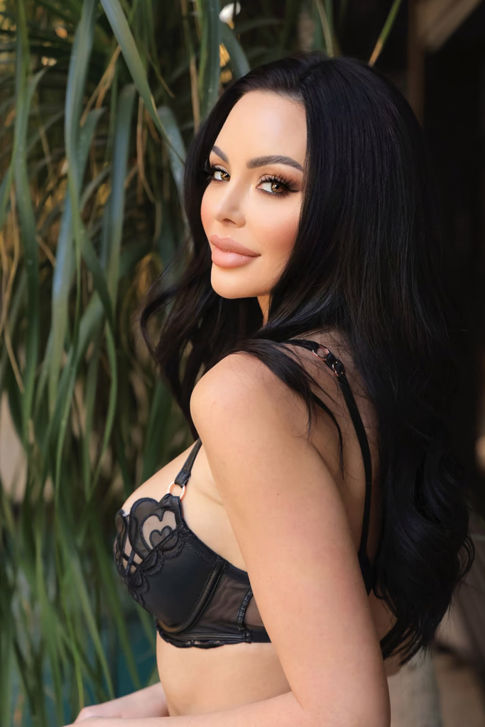 Emelina Adams in a black bra