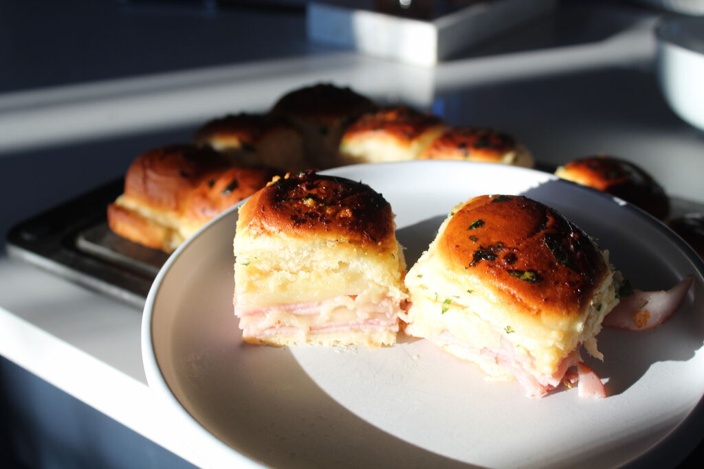 Playboy Club model Alicia Fernandez makes a batch of ham & cheese sliders for Super Bowl LIX.